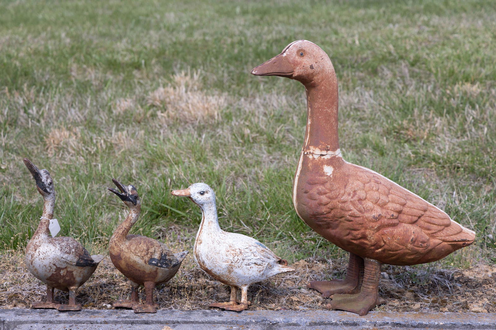 VINTAGE CAST-IRON FIGURAL GARDEN GEESE, LOT OF FOUR (1 of 2)