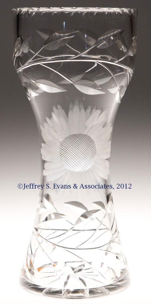 FRY CUT GLASS VASE: FRY CUT GLASS VASE, star-cut base, cut sunflower and intaglio foliage, etched signature on base. H. C. Fry Glass Co. First quarter 20th century. 12" HOA, 5 1/4" D rim. Provenance: Collection of Jack &
