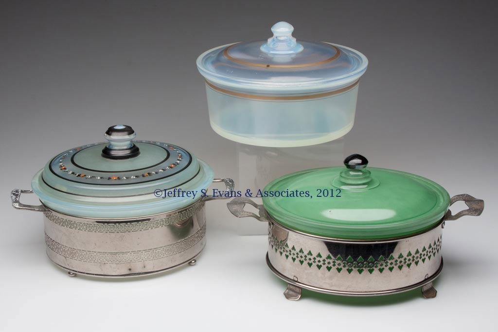 FRY KITCHENWARE COVERED DISHES, LOT OF THREE: FRY KITCHENWARE COVERED DISHES, LOT OF THREE, two opalescent and one green flashed/stained, #1922-8 with gold band, #1922-8 with metal stand, and #1938-8 with decorated cover and metal stand. H. C. Fr