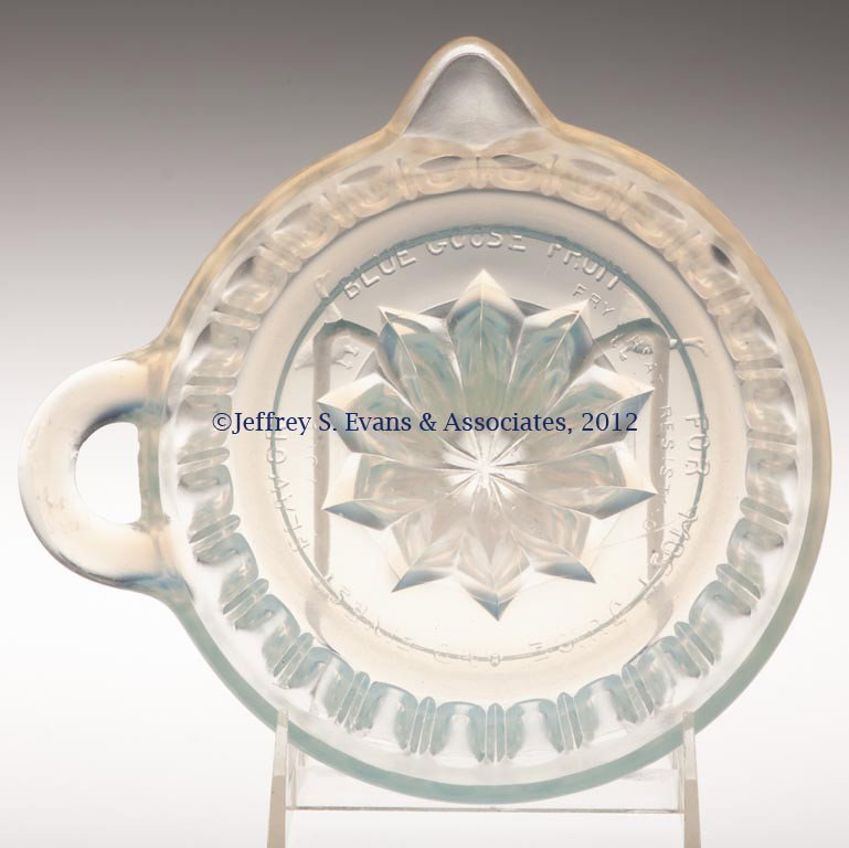 FRY KITCHENWARE BLUE GOOSE REAMER: FRY KITCHENWARE BLUE GOOSE REAMER, opalescent, plain rim, embossed with Blue Goose Fruit advertisement in base. H. C. Fry Glass Co. First half 20th century. 6 1/4" D. Provenance: Collection of Jack & 
