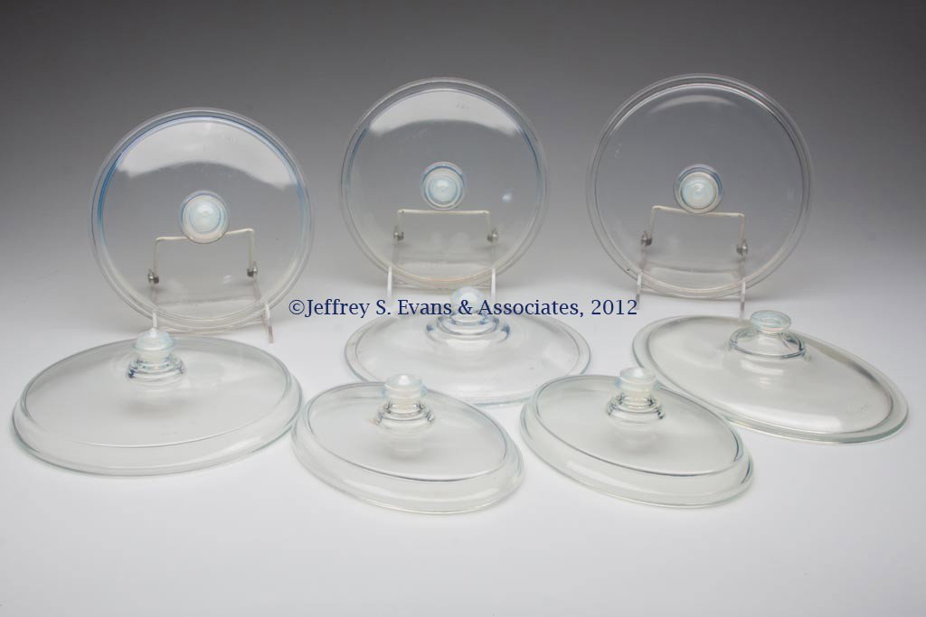 FRY KITCHENWARE COVERS, LOT OF EIGHT: FRY KITCHENWARE COVERS, LOT OF EIGHT, opalescent, various oval and round sizes. H. C. Fry Glass Co. First half 20th century. Provenance: Collection of Jack & Dorothy Jordan.