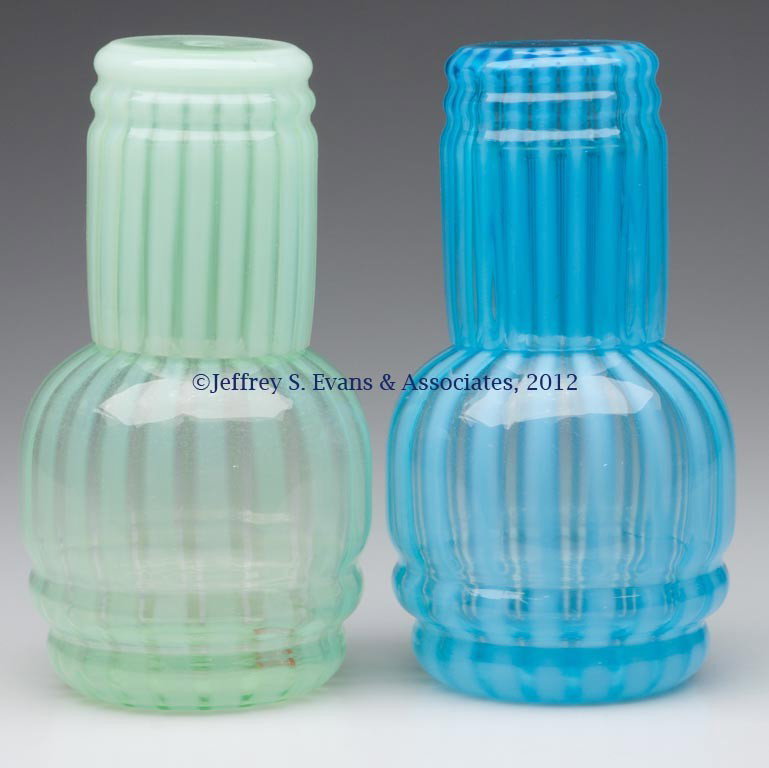 FENTON RIB OPTIC TUMBLE-UPS, LOT OF TWO: FENTON RIB OPTIC TUMBLE-UPS, LOT OF TWO, blue and pale green opalescent. Fenton Art Glass Co. First half 20th century. 7" H. Provenance: Collection of Jack & Dorothy Jordan.