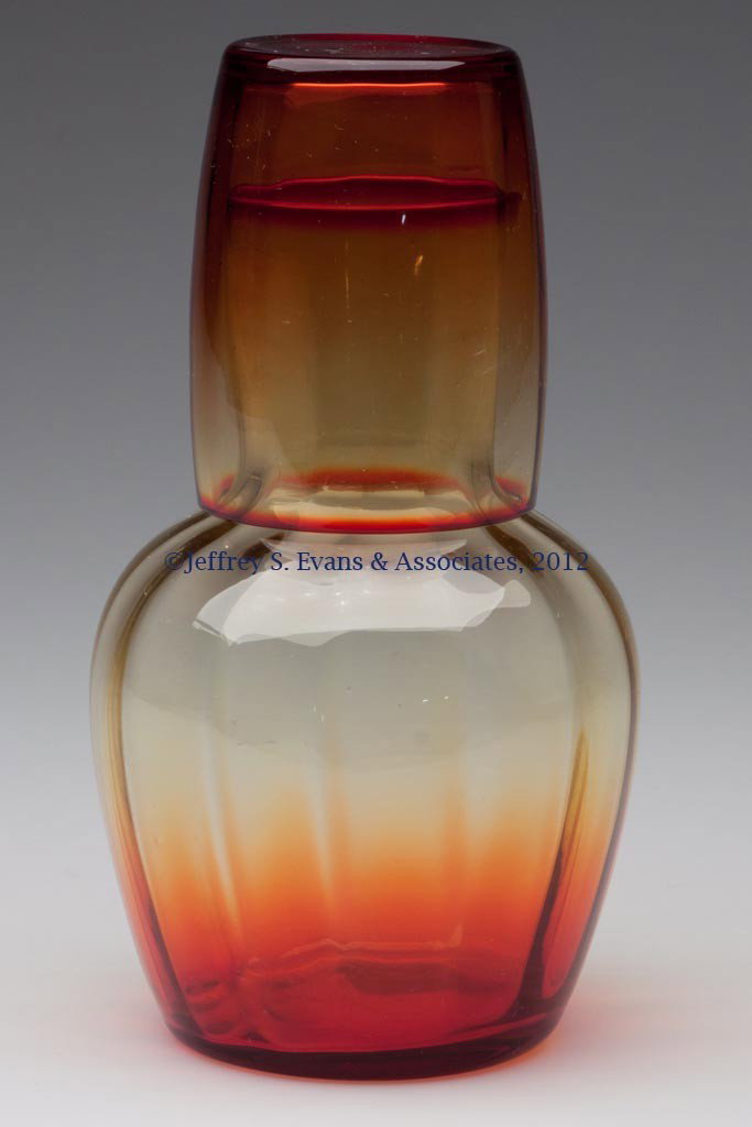 WIDE RIB OPTIC TUMBLE-UP: WIDE RIB OPTIC TUMBLE-UP, amberina. 20th century. 7" H. Provenance: Collection of Jack & Dorothy Jordan.