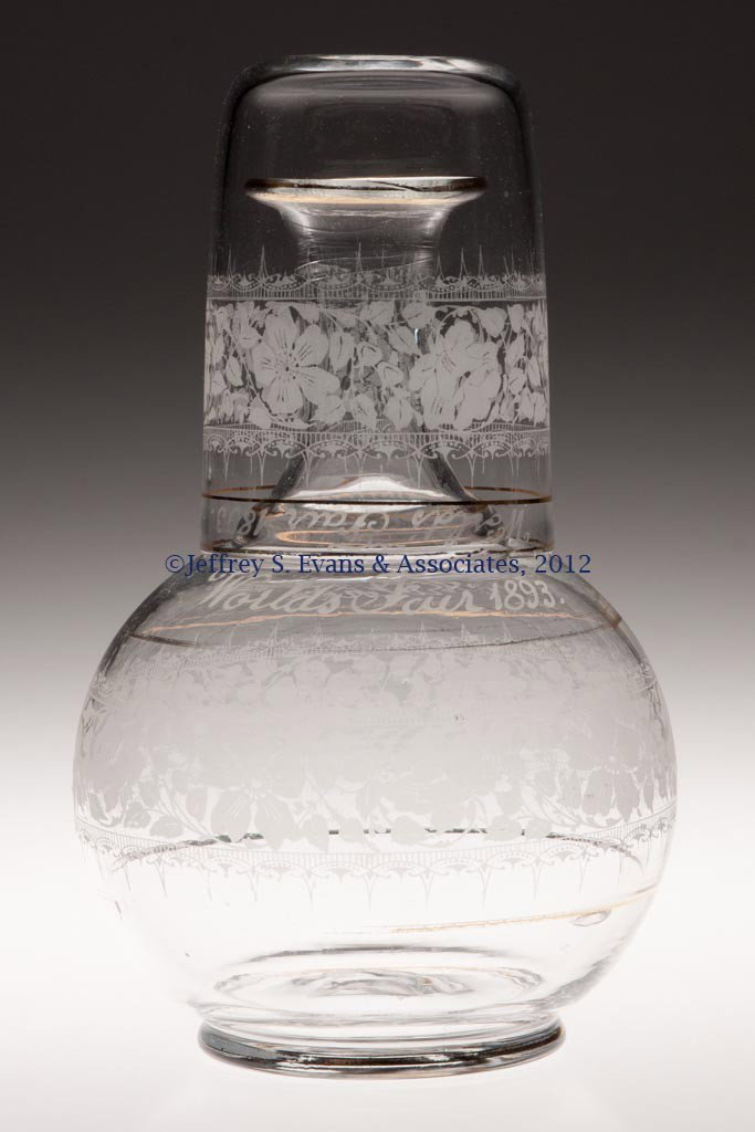 1893 CHICAGO WORLD'S FAIR ETCHED SOUVENIR TUMBLE-U: 1893 CHICAGO WORLD'S FAIR ETCHED SOUVENIR TUMBLE-UP, colorless, both bottle and tumbler engraved with "World's Fair 1893" and "Mother" above a band of floral etching. Bottle with rough pontil mark. Fo