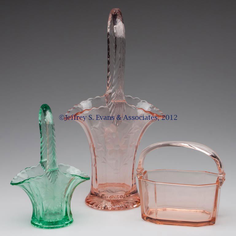 ASSORTED DEPRESSION GLASS BASKETS, LOT OF THREE: ASSORTED DEPRESSION GLASS BASKETS, LOT OF THREE, pink and green, comprising two with wheel-cut decorations and one signed Heisey example. First half 20th century. 4 3/4" to 12" H. Provenance: Collecti