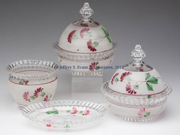 NEVADA TABLE ARTICLES, LOT OF FOUR: NEVADA TABLE ARTICLES, LOT OF FOUR, colorless with polychrome decoration, comprising two butter dishes, a relish dish, and a sugar bowl lacking a cover. Early 20th century. 1 1/4" to 6 3/4" HOA. Prove
