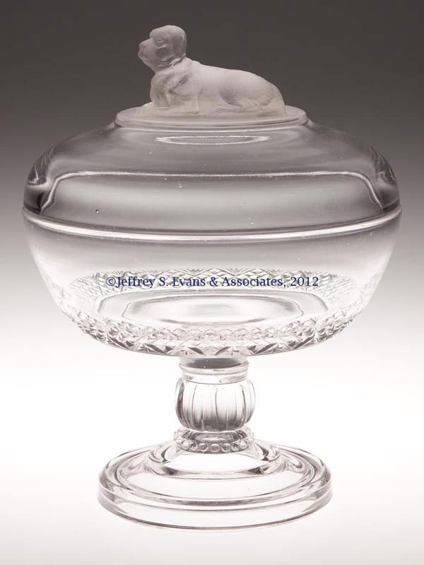 ST. BERNARD COVERED COMPOTE: ST. BERNARD COVERED COMPOTE, colorless and frosted, on high standard patterned stem, wafer construction. Fostoria Glass Co Late 19th/early 20th century. 9 1/4" HOA, 7 1/4" D. Provenance: Jerry Lynn Wo