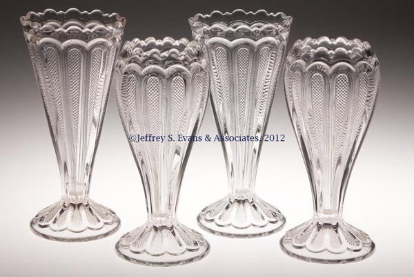 TEXAS / LOOP WITH STIPPLED PANELS VASES, TWO PAIR: TEXAS / LOOP WITH STIPPLED PANELS VASES, TWO PAIR, colorless, comprising one pair of straight-sided examples, and one pair of cupped examples. Early 20th century. 9 1/4" and 8 3/4" H. Provenance: Jerr