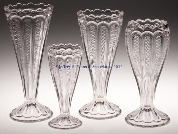 TEXAS / LOOP WITH STIPPLED PANELS VASES, LOT OF FO: TEXAS / LOOP WITH STIPPLED PANELS VASES, LOT OF FOUR, colorless, comprising three straight-sided examples and one cupped. Early 20th century. 7" to 10" H. Provenance: Jerry Lynn Wood estate, Dequincy,
