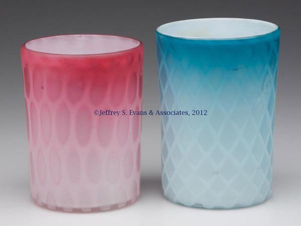 AIR-TRAP MOTHER-OF-PEARL SATIN GLASS TUMBLERS, LOT: AIR-TRAP MOTHER-OF-PEARL SATIN GLASS TUMBLERS, LOT OF TWO, shaded rose and shaded blue, comprising a Diamond Quilted example and a Honeycomb, each with a polished pontil mark. Fourth quarter 19th cent