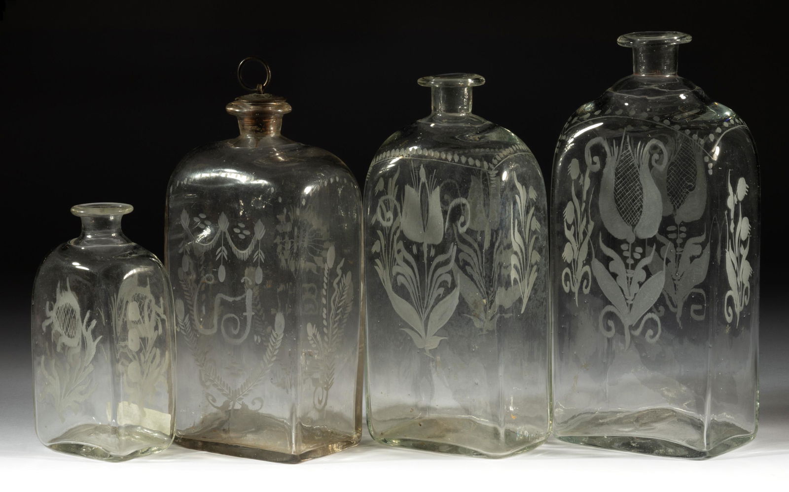 HALF-POST BLOWN AND ENGRAVED CASE BOTTLES, LOT OF FOUR (1 of 1)