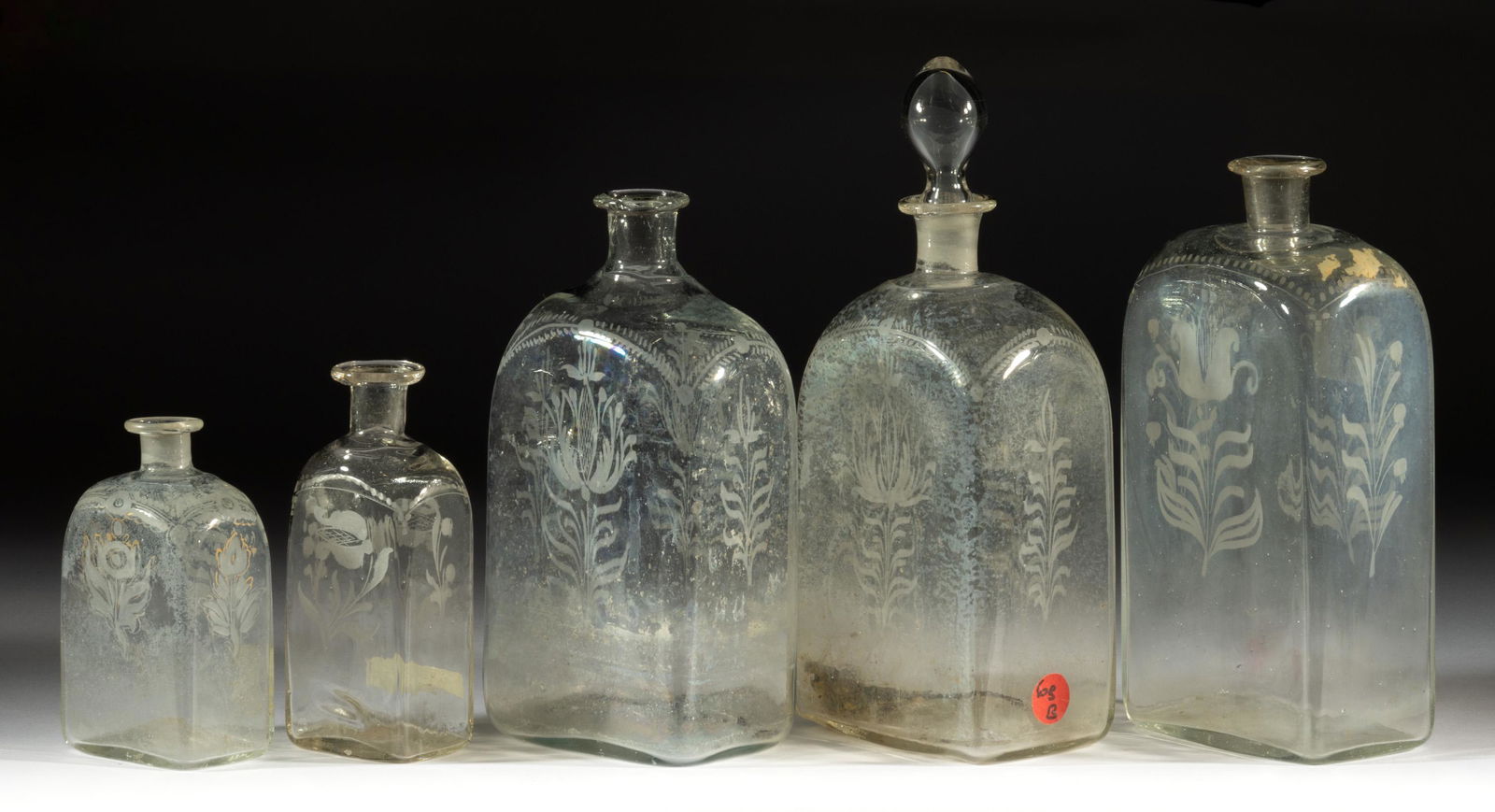 HALF-POST BLOWN AND ENGRAVED CASE BOTTLES, LOT OF FIVE (1 of 1)