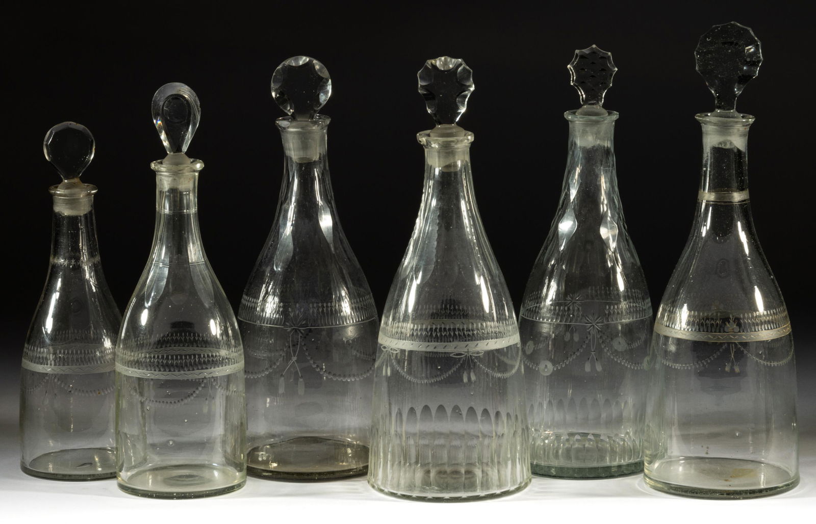 ASSORTED FREE-BLOWN AND ENGRAVED GLASS PRUSSIAN-FORM DECANTERS, LOT OF SIX (1 of 1)