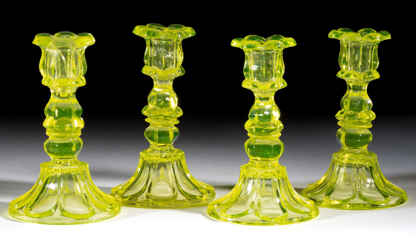 PRESSED PETAL AND LOOP CANDLESTICKS, LOT OF FOUR (1 of 1)