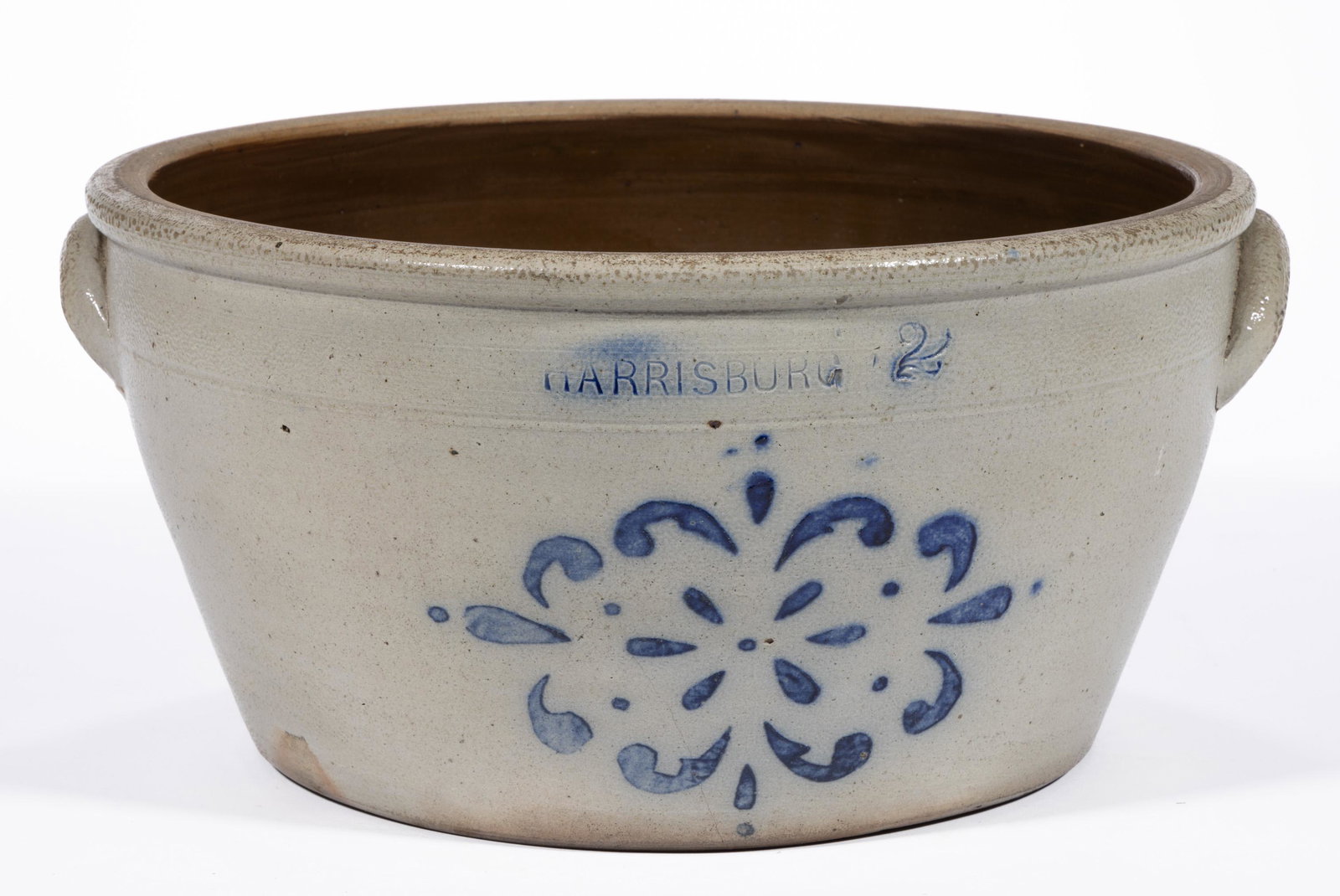 STAMPED "HARRISBURG", PENNSYLVANIA STENCILED STONEWARE MILK BOWL: STAMPED "HARRISBURG", PENNSYLVANIA STENCILED STONEWARE MILK BOWL, salt-glazed, "2" gallon capacity mark, flat-top rim, one incised shoulder ring, and applied arched handl
