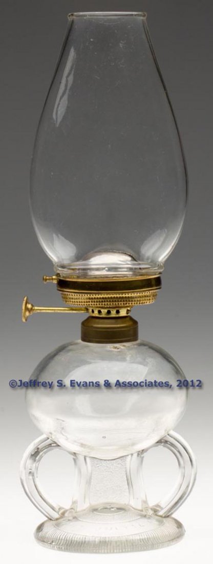 RIPLEY PATENTED FOOTED FINGER LAMP: RIPLEY PATENTED FOOTED FINGER LAMP, colorless, double molded handles, stippled center support, base embossed "RIPLEY & CO. PATD JAN 7. JULY. 14. AUG 11. 1868." and a "2" in center, No. 1 fine line col