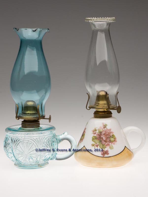 VARIOUS PATTERNS FINGER LAMPS, LOT OF TWO: VARIOUS PATTERNS FINGER LAMPS, LOT OF TWO, each with No. 1 brass collar, comprising a teal green Feather Duster, molded handle; and an unpatterned conical-form with floral polychrome decoration, appli