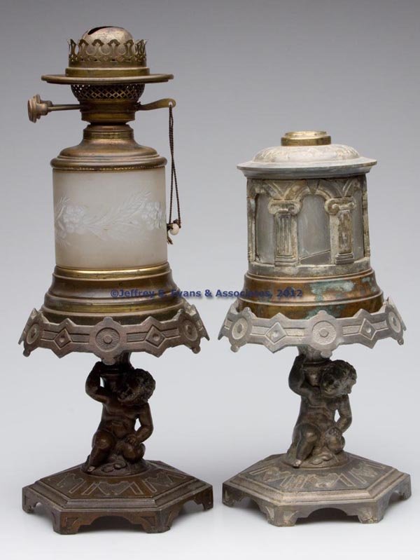 J. F. IDEN FIGURAL STEM STAND LAMP: J. F. IDEN FIGURAL STEM STAND LAMP, colorless font in brass holder with frosted finish, cut and engraved floral pattern, font base embossed ""IDEN & CO N. Y.", stem depicting a cherub holding urn, mou