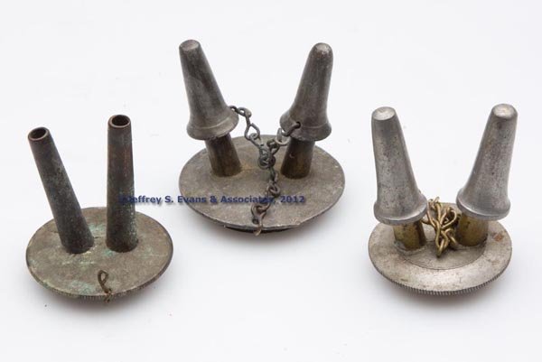 ASSORTED FLUID BURNERS, LOT OF THREE: ASSORTED FLUID BURNERS, LOT OF THREE, comprising two pewter and brass double-tube examples with chain and caps, and one all brass double-tube example lacking chain and caps. Mid 19th century. 1 3/4" H
