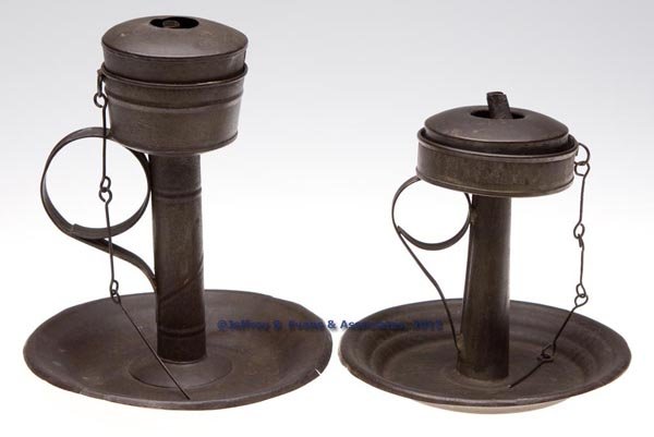 SHEET IRON KETTLE GREASE LAMPS ON STANDS, LOT OF T: SHEET IRON KETTLE GREASE LAMPS ON STANDS, LOT OF TWO, each with kettle-form holder, drop-in font, probably together by association and with single tube wick support, one example with a ring and twist 