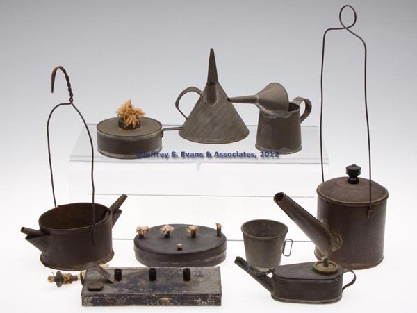 SHEET IRON LIGHTING ARTICLES, LOT OF NINE: SHEET IRON LIGHTING ARTICLES, LOT OF NINE, comprising six lamps including three shop/occupational, a grease lamp with double wick supports, two lamp fillers, a drop-in single-tube burner, and a cover 