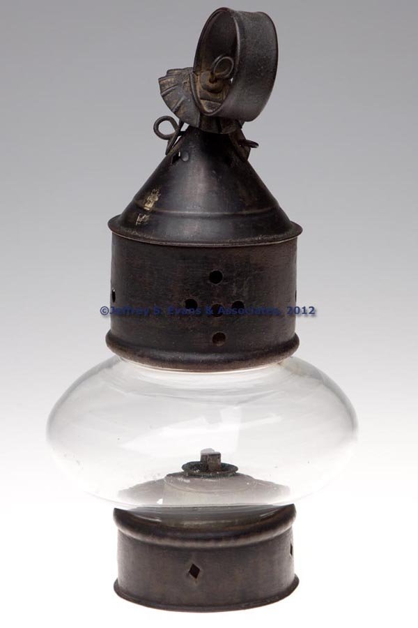 GLASS AND PIERCED SHEET IRON ONION LANTERN: GLASS AND PIERCED SHEET IRON ONION LANTERN, colorless compressed globe with attached base band, base with a ring for font removal, cylinder and conical peak top with pierced geometric decorations and 
