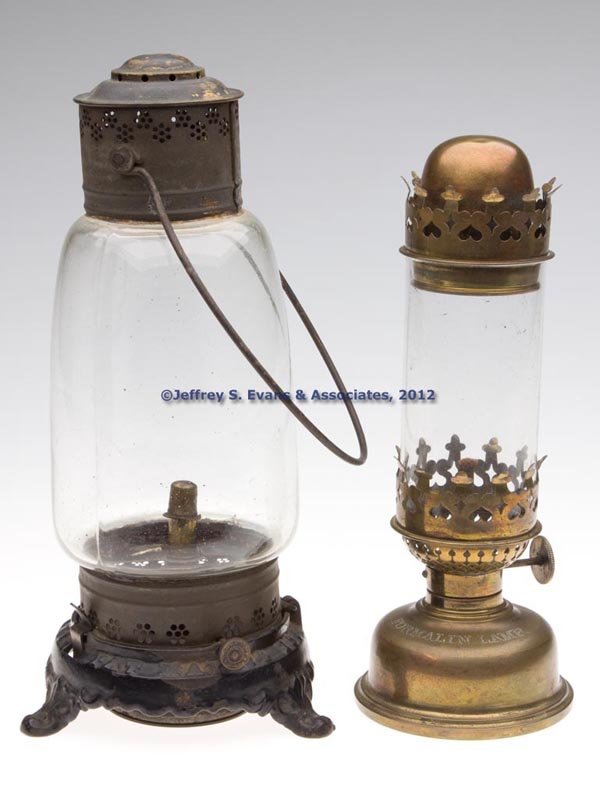 VARIOUS LIGHTING DEVICES, LOT OF TWO: VARIOUS LIGHTING DEVICES, LOT OF TWO, comprising a marked "G F J COLBURN PAT MAY 24 1864" lantern with punched sheet iron and brass cap, fixed colorless globe, and bail handle, base of globe frame hin