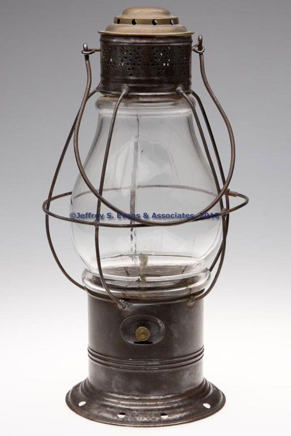 BRASS AND SHEET IRON RAILROAD LANTERN: BRASS AND SHEET IRON RAILROAD LANTERN, bail handle, side of base fitted with a James Breckenridge indention for font thumbwheel, marked "PATENT MAR 17 1863", fixed colorless globe with wire guard, rem