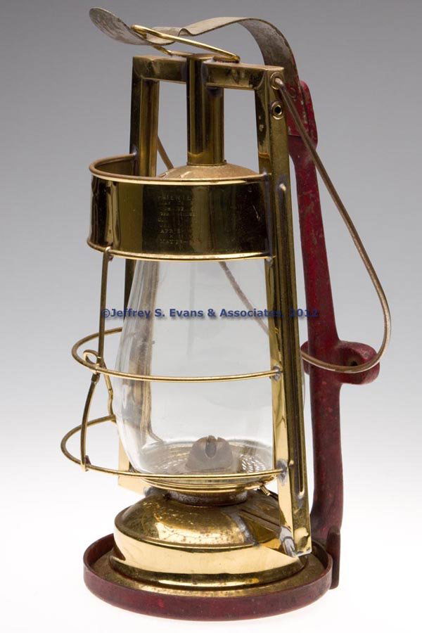 DIETZ "QUEEN" FIRE DEPARTMENT BRASS HOT BLAST TUBU: DIETZ "QUEEN" FIRE DEPARTMENT BRASS HOT BLAST TUBULAR LANTERN WITH CAST IRON AND METAL BRACKET, polished, bail handle and apparatus hook, wind guard marked "'PATENTED MAY. 24. 87 / MCH. 13. 88 / APR.