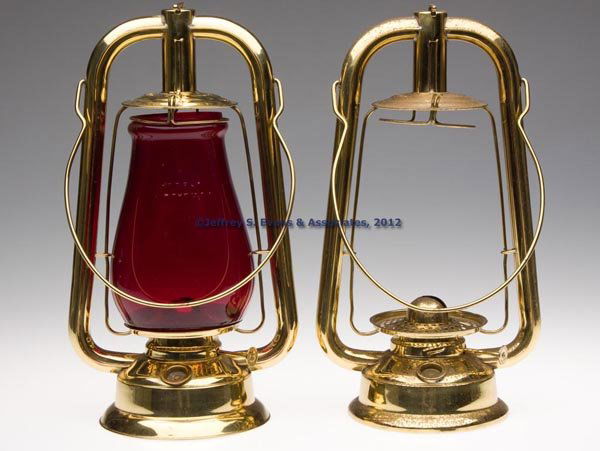 DIETZ U. S. BRASS HOT BLAST TUBULAR LANTERNS, LOT: DIETZ U. S. BRASS HOT BLAST TUBULAR LANTERNS, LOT OF TWO, polished, bail handles, caps marked "US. BRASS. L.W TUBULAR", one example fitted with a red/ruby globe embossed "RAYO HOT BLAST", underside of