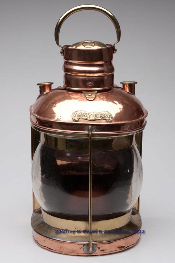 BRASS AND COPPER MASTHEAD MARINE LIGHT: BRASS AND COPPER MASTHEAD MARINE LIGHT, polished, flat back with hinged door and interior with reflector bracket, fitted with two interior cylinders for mounting, hinged cover with single ring and han