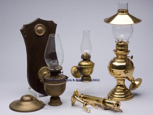 BRASS GIMBAL-MOUNTED LIGHTING ARTICLES, LOT OF FOU: BRASS GIMBAL-MOUNTED LIGHTING ARTICLES, LOT OF FOUR, comprising three lamps with weighted bases, including one example marked "PERKO" on yoke, one example with a smoke bell, and an unmarked example wi