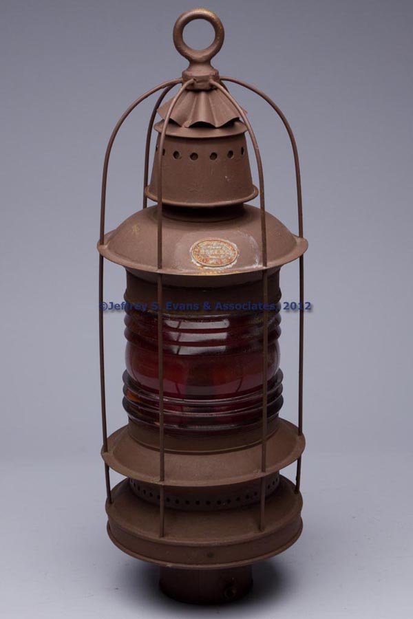 HANDLAN-BUCK MANUFACTURING CO. SHEET IRON MARINE /: HANDLAN-BUCK MANUFACTURING CO. SHEET IRON MARINE / RAILROAD LANTERN, painted primer red, ring handle, cover with maker's plate marked "HANDLAN-BUCK MFG CO. / MAKERS / ST. LOUIS", 360 degree red/ruby c