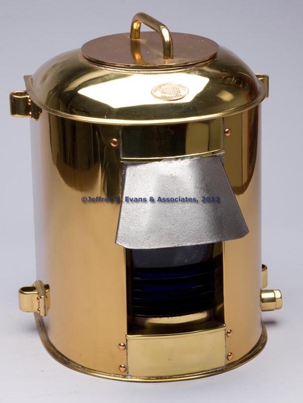PERKINS "PERKO" BRASS ELECTRIC MASTHEAD MARINE LIG: PERKINS "PERKO" BRASS ELECTRIC MASTHEAD MARINE LIGHT, polished, flat back with four mounting lugs, removable flat top with handle and interior with "PERKO" maker's plate, maker's oval plate marked "PE