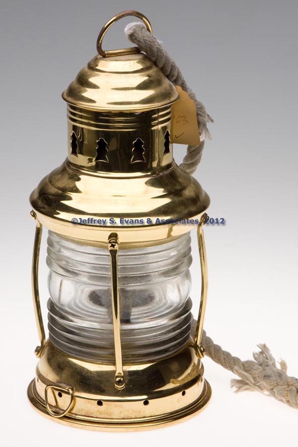 PERKINS "PERKO" BRASS MARINE LANTERN: PERKINS "PERKO" BRASS MARINE LANTERN, polished, ring handle, two tie-down rings, 360 degree colorless fresnal lens marked "PERKINS", removable font with underside impressed "PERKO". Fitted with a Helv