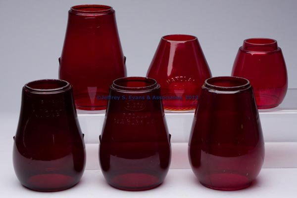 RED / RUBY GLOBES, LOT OF SIX: RED / RUBY GLOBES, LOT OF SIX, comprising four Dietz examples, including three embossed "DIETZ FITZALL / NEW YORK U.S.A. and reverse "LOC NOB / PATD - 3 - 10 - 14", and other embossed "DIETZ VESTA / N