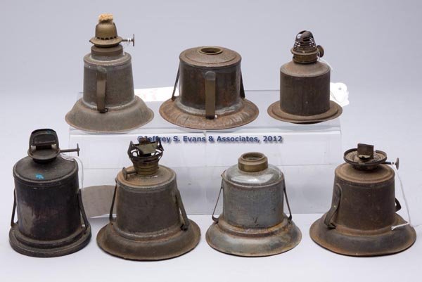 SHEET IRON AND BRASS LANTERN FONTS, LOT OF SEVEN: SHEET IRON AND BRASS LANTERN FONTS, LOT OF SEVEN, six examples fitted with spring mechanism, including one marked "H O J SANGSTERS PATENT 1851", "NATIONAL METAL SPINNING & STAMPING CO.", and an exampl
