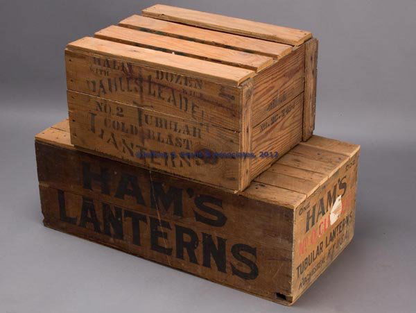 LANTERNS WOODEN SHIPPING CRATES, LOT OF TWO: LANTERNS WOODEN SHIPPING CRATES, LOT OF TWO, comprising a Ham's No. 0 Clipper Tubular Lanterns and a Paull's Leader No. 2 Tubular Cold Blast Lanterns. First quarter 20th century. 16" x 20" and 15" x 3