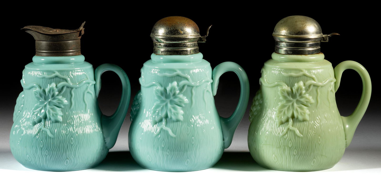 GRAPE AND VINE OPAQUE GLASS SYRUP PITCHERS, LOT OF THREE (1 of 1)