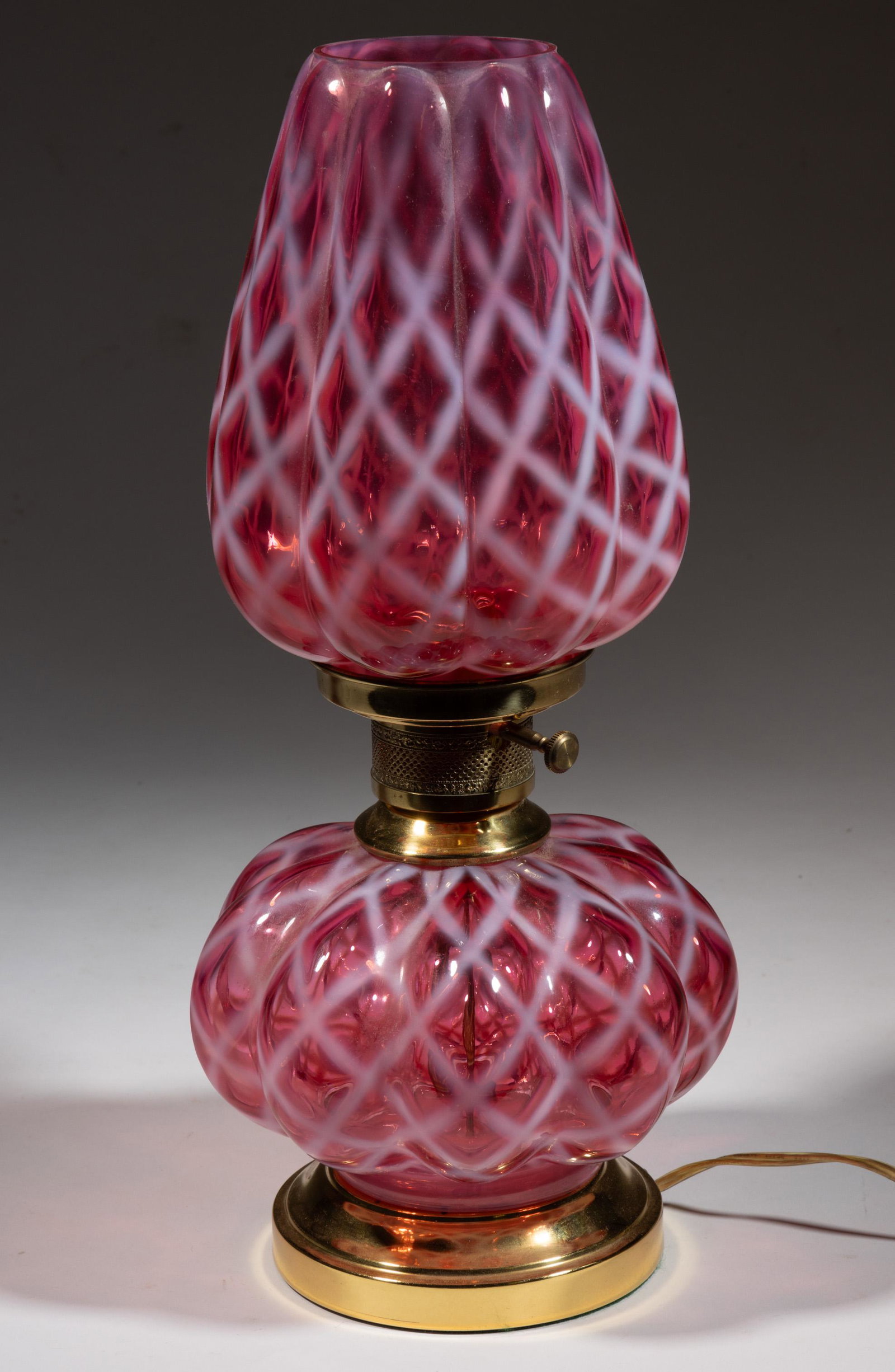FENTON OPAL LATTICE PARLOR LAMP: FENTON OPAL LATTICE PARLOR LAMP, cranberry opalescent, melon-form, base and shade. Fenton Art Glass Co. Second half 20th century. 17" HOA. Provenance: From a Virginia private collection. 