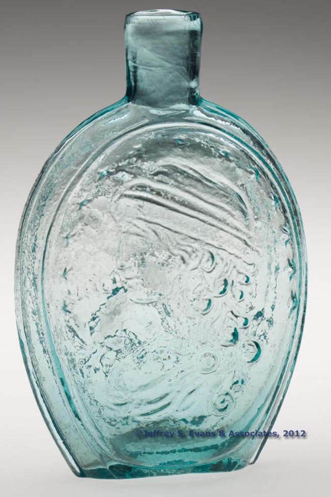 GI-121 COLUMBIA - EAGLE PORTRAIT FLASK: GI-121 COLUMBIA - EAGLE PORTRAIT FLASK, strong aquamarine, pint, embossed "B&W" in script below eagle, sheared mouth, rough pontil mark. Unknown United States glass house. 1840-1860. 6 3/4" H. "Proven