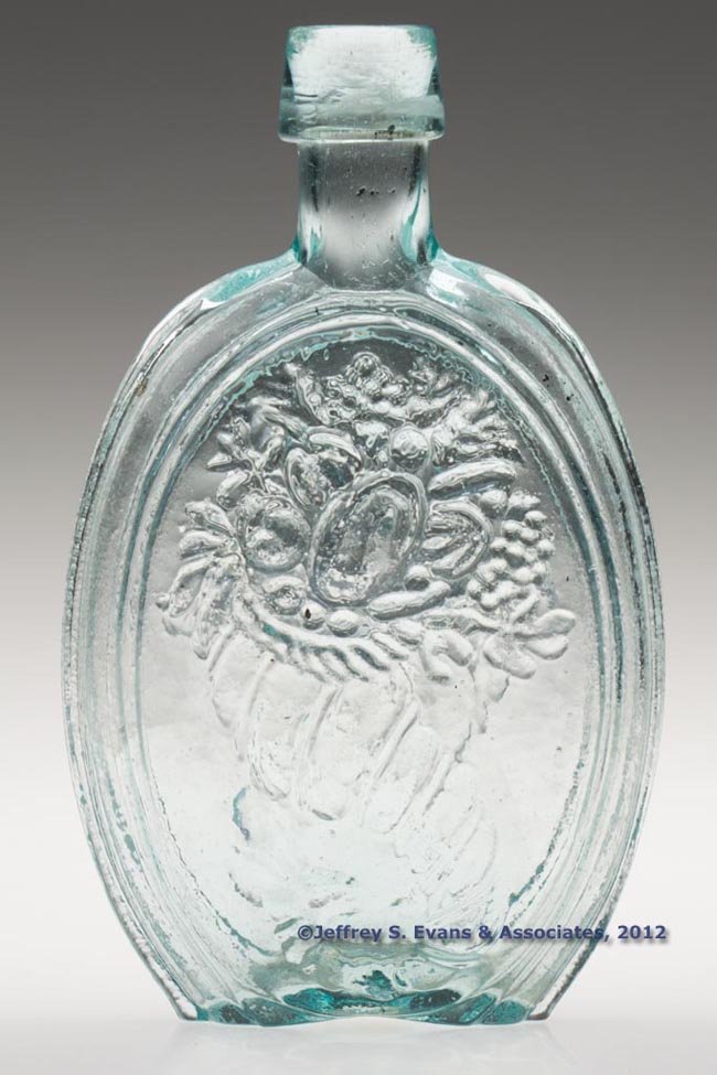 GIII-2 CORNUCOPIA PICTORIAL FLASK: GIII-2 CORNUCOPIA PICTORIAL FLASK, aquamarine, half-pint, applied broad sloping collar, rough pontil mark. Possibly Kensington Glass Works, Philadelphia. 1840-1860. 6" H. "Provenance: The Thomas Dale 