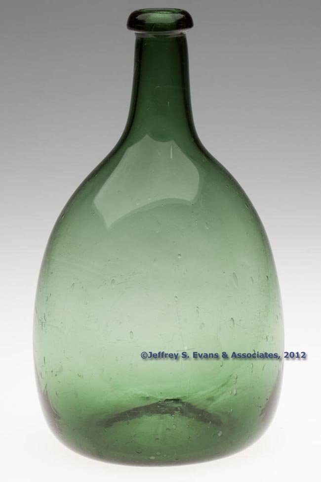 FREE-BLOWN CHESTNUT-FORM FLASK: FREE-BLOWN CHESTNUT-FORM FLASK, olive green, flattened ovoid body with lightly molded vertical ribs at base sides, slightly pinched shoulders, medium neck and rolled-over rounded mouth, kick-up base w