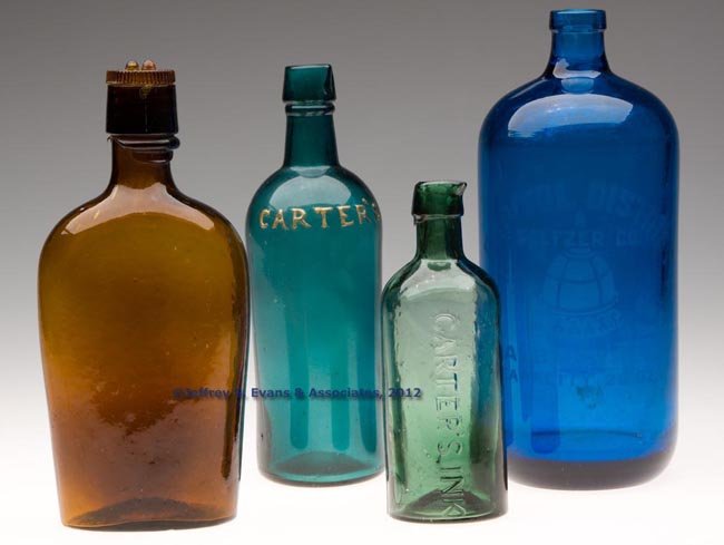 ASSORTED LETTERED BOTTLES, LOT OF FOUR: ASSORTED LETTERED BOTTLES, LOT OF FOUR, comprising a medium moss green "CARTER'S INK", a teal green "CARTER'S", an amber "WHITNEY GLASS WORKS" pint flask with glass screw stopper, and a bright electri