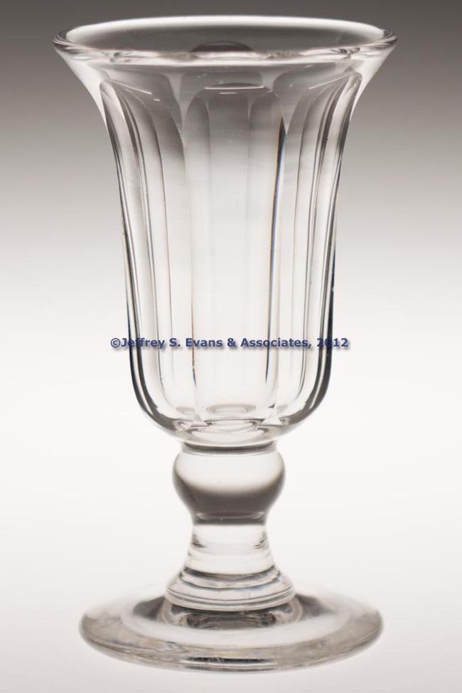 CUT EIGHT-PANEL CELERY GLASS: CUT EIGHT-PANEL CELERY GLASS, colorless, heavy deep bowl with plain rim, raised on an applied inverted baluster-form stem and plain foot with polished pontil mark. Possibly Pittsburgh or Wheeling. 182