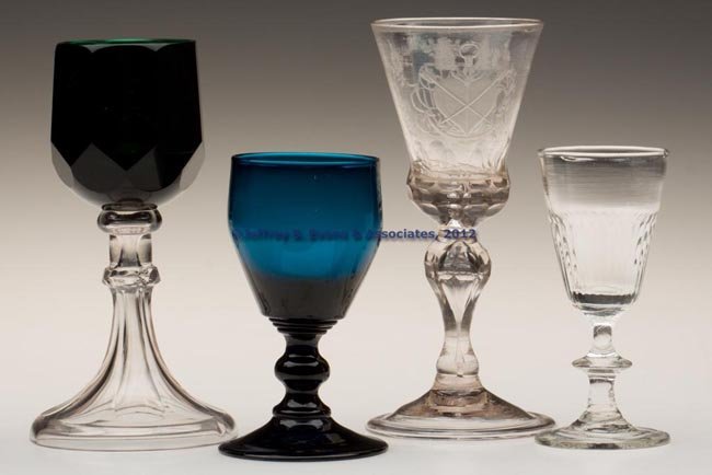ASSORTED WINE GLASSES, LOT OF FOUR: ASSORTED WINE GLASSES, LOT OF FOUR, including a colorless engraved example dated 1760, three with rough pontil mark. 18th and 19th centuries. 4 1/4" to 6 1/4" H. Provenance: Collection of George Kahnl