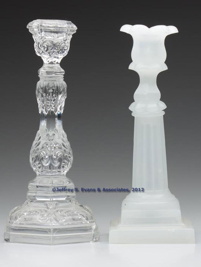 ASSORTED PRESSED CANDLESTICKS, LOT OF TWO: ASSORTED PRESSED CANDLESTICKS, LOT OF TWO, comprising an alabaster/clambroth Columnar and a colorless Acanthus Leaf, each with wafer construction. Boston & Sandwich Glass Co. and possibly others. 1845