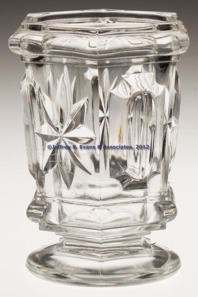 PRESSED STAR AND BUCKLE SPOON HOLDER / SPILL: PRESSED STAR AND BUCKLE SPOON HOLDER / SPILL, colorless lead glass, polished pontil mark. 1850-1870. 4 7/8" H. Provenance: Collection of George Kahnle and Richard LaBarge, Victory Mills, NY.
