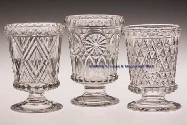 VARIOUS PRESSED EAPG SPOON HOLDERS / SPILLS, LOT O: VARIOUS PRESSED EAPG SPOON HOLDERS / SPILLS, LOT OF THREE, colorless lead glass, comprising a Bull's Eye and Rosette, Concentric Diamonds, and Inverted Diamond and Thumbprint with cross hatching in th