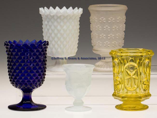 ASSORTED PRESSED EAPG TABLE ARTICLES, LOT OF FIVE: ASSORTED PRESSED EAPG TABLE ARTICLES, LOT OF FIVE, including a clambroth Ashburton egg cup and an opaque white Sawtooth spoon holder. Boston & Sandwich Glass Co. and others. 1840-1880. Various sizes.